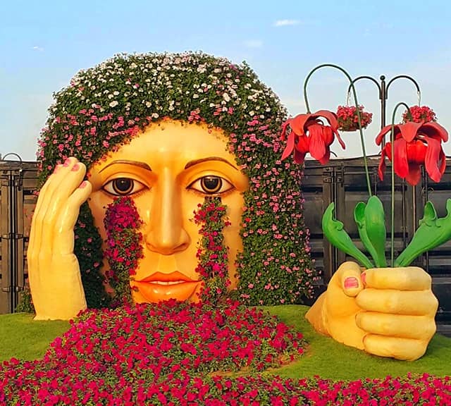 Petunia, Verbena and Marigold flowers are used to decorate the Crying Lady sculpture at the Dubai Miracle Garden